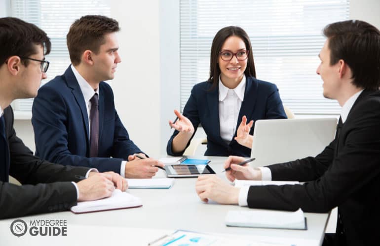 Employment Law specialist meeting with colleagues in an office