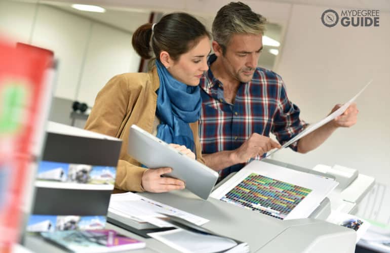 professional writers checking the manuscript before printing in a publishing house