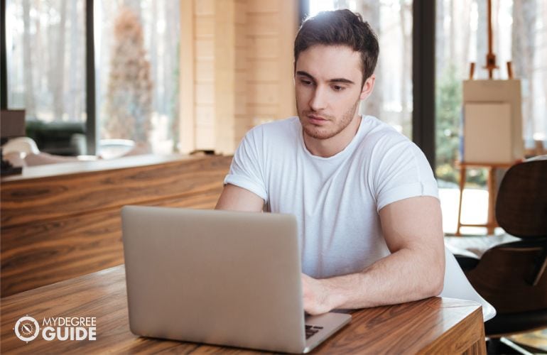 student taking his Environmental Management Degree Online