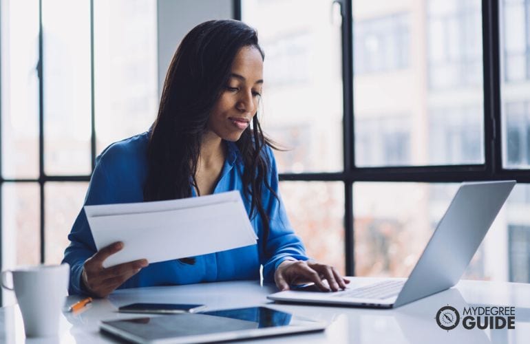 Woman preparing Environmental Management Masters requirements 