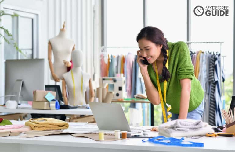 fashion designer talking to a client on the phone