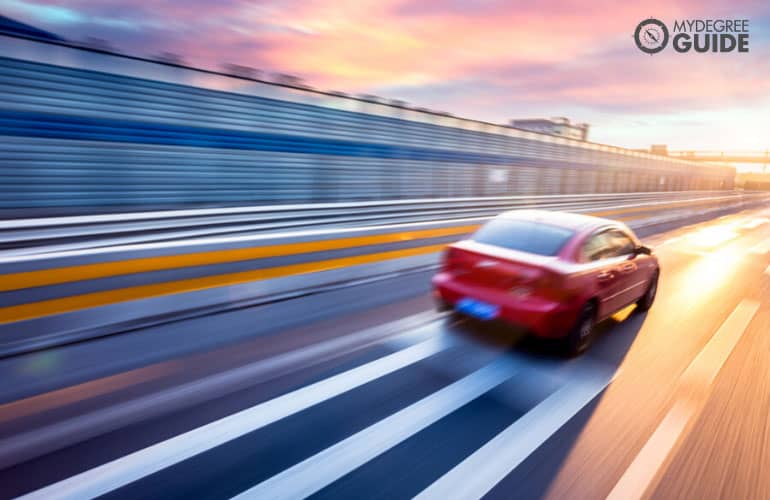 car driving fast on a highway