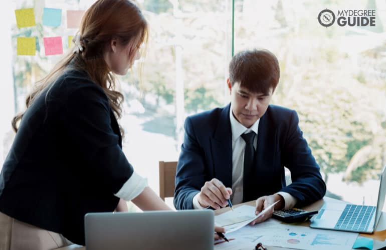 male accountant checking financial statements