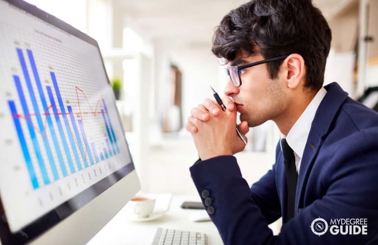 male office worker looking at his computer