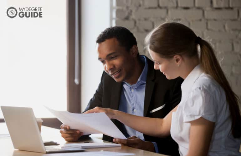 banker talking to a client over some documents