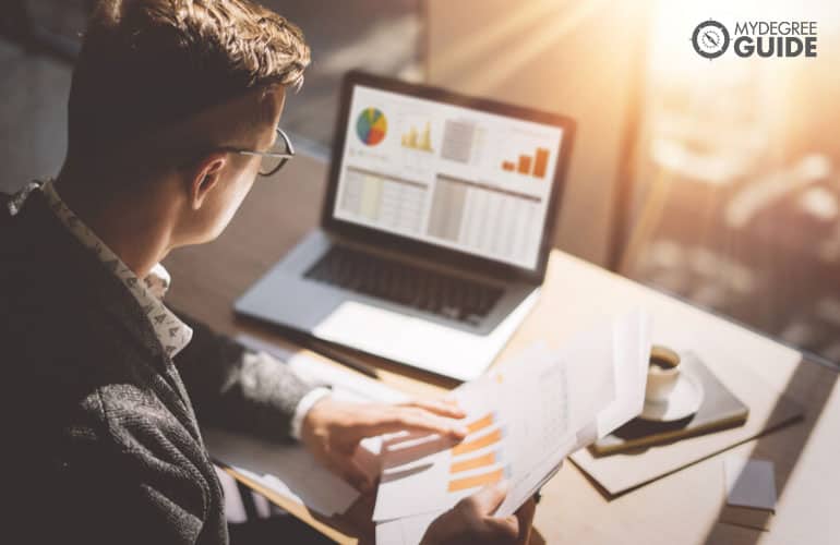 finance analyst working on his computer