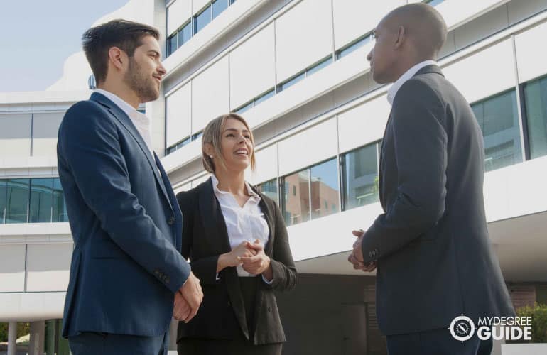 businessmen talking to close a deal