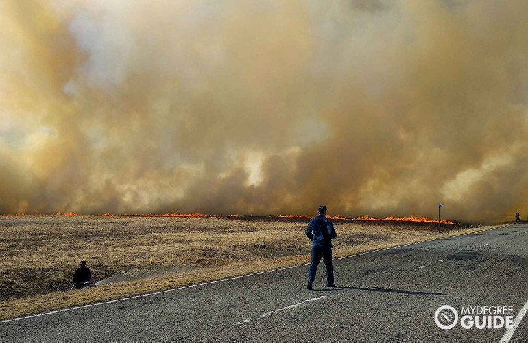 firefighters trying to control the wildfire