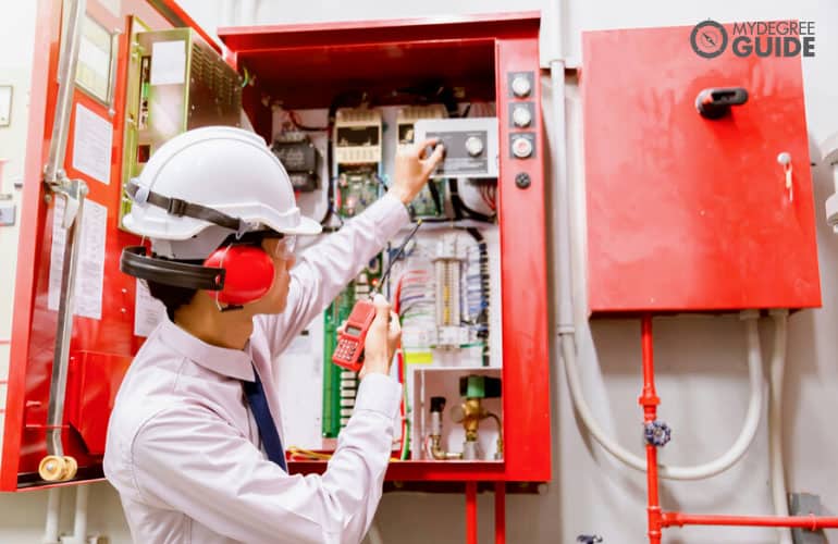 Fire Protection Engineer inspecting a fire control system