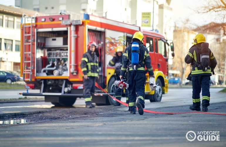 firefighters working together in putting out a fire