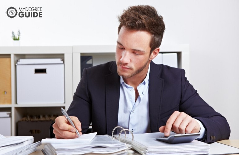 forensic accountant working in his office