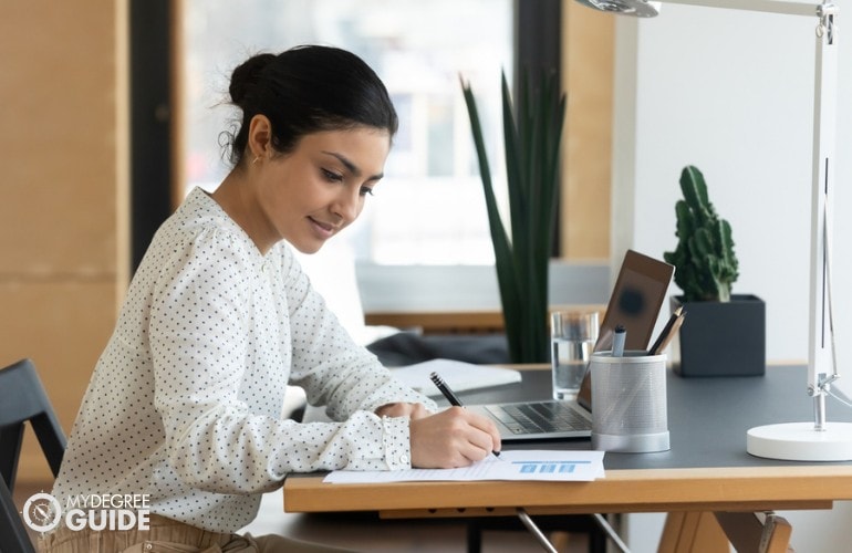 Budget Specialist working in her office