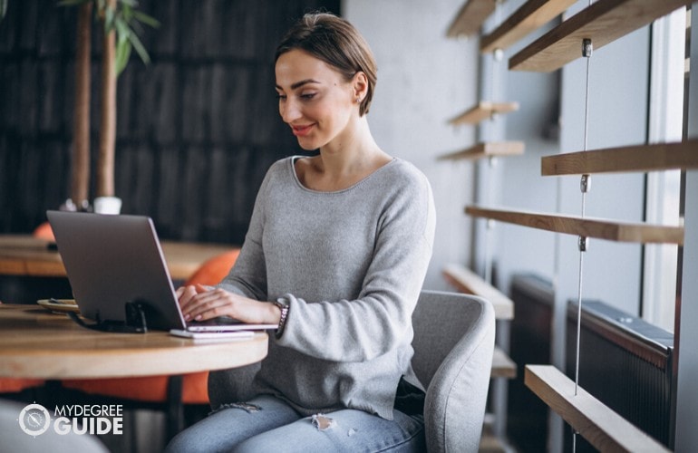 human resource manager studying at a cafe