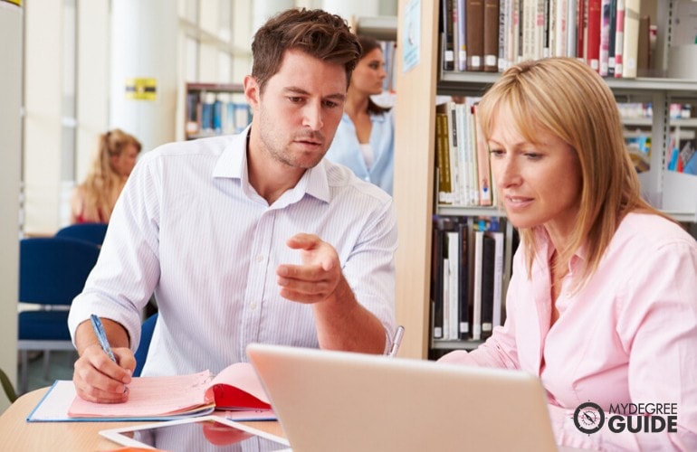 PhD in Psychology students studying in the library