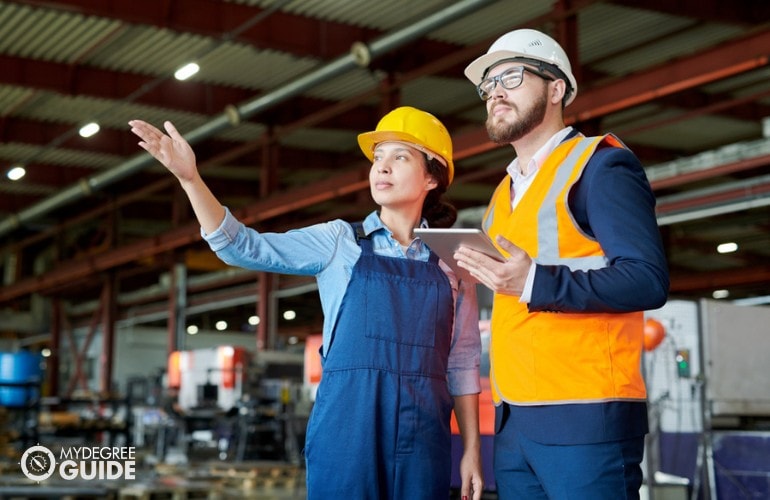 Logisticians working in a factory
