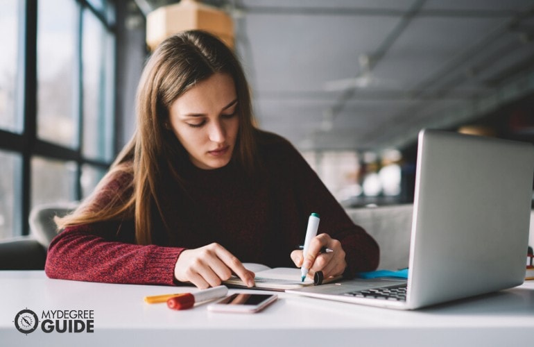 political science student studying on her computer