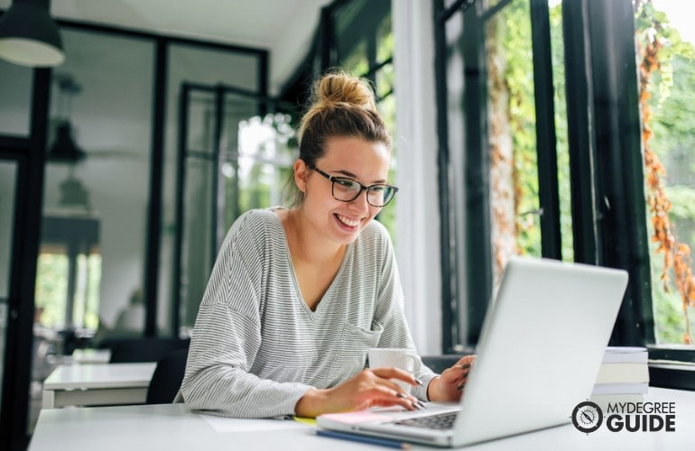 Public Relations Degree student studying on her laptop