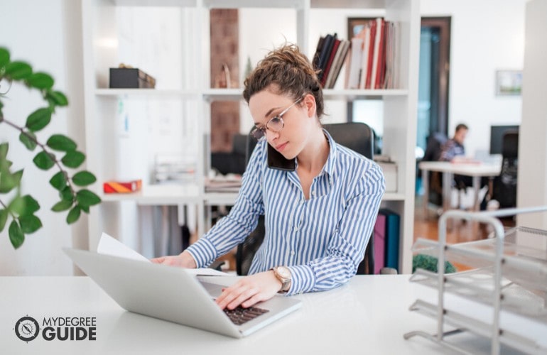 office secretary working on her laptop