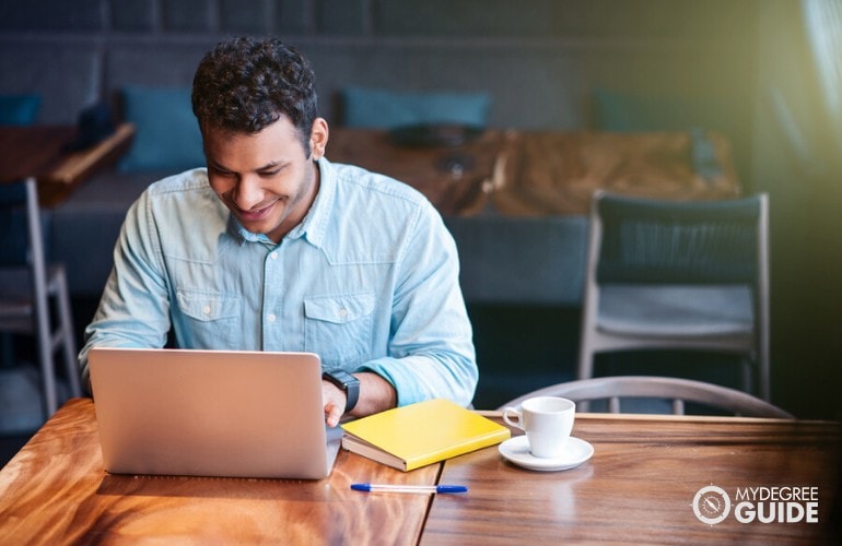 data science student studying at a cafe