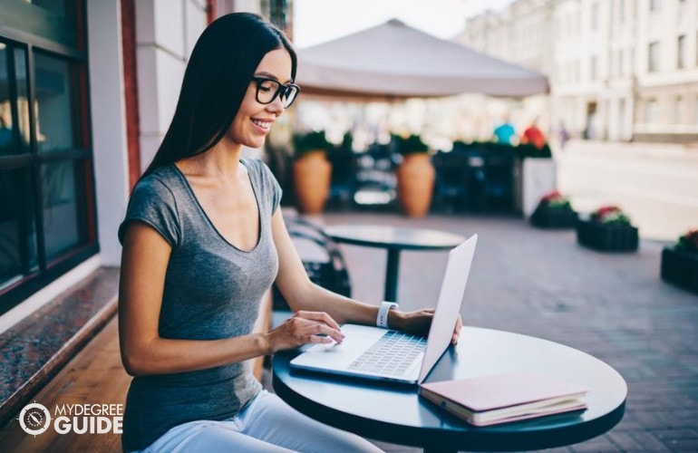 Engineering degree student studying on her laptop