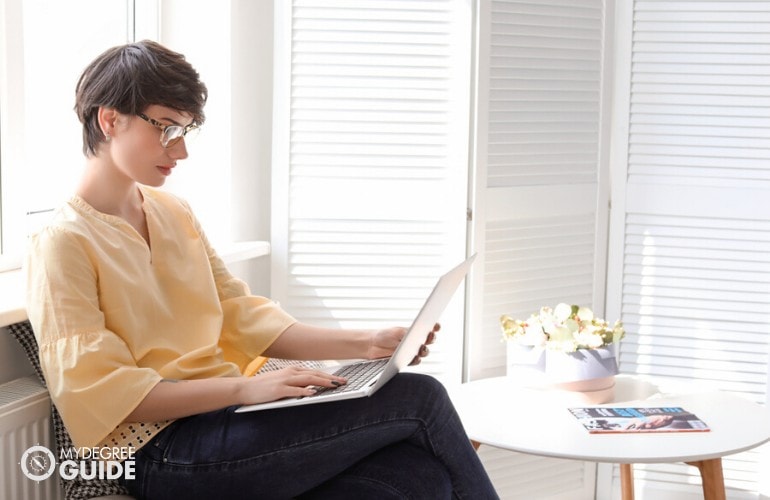 Master's in Emergency management student studying on her laptop at home