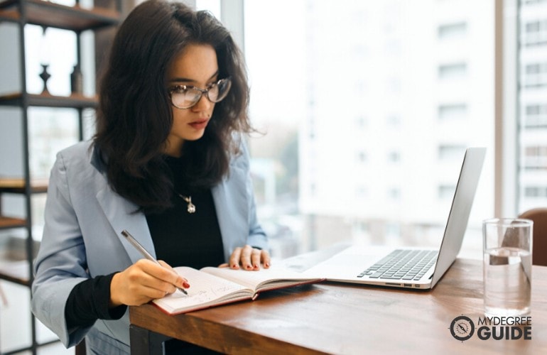 master's in English student studying on her laptop