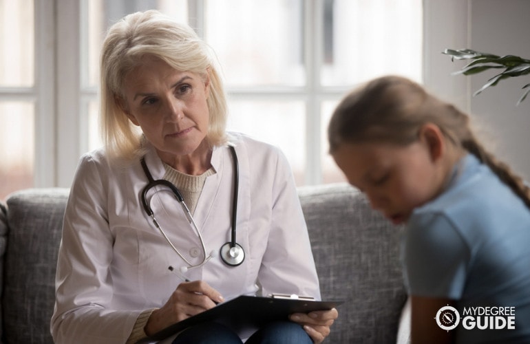 Grief Counselor comforting a child