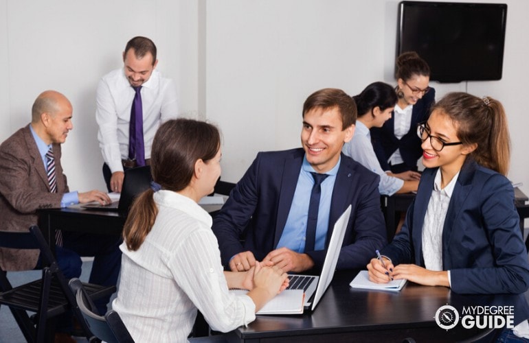 Health Informatics Professionals meeting at a conference