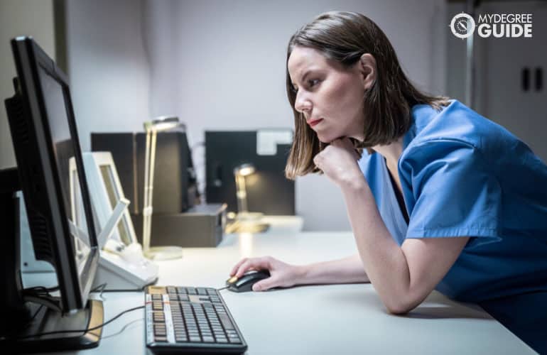 Health Informatics officer working on computer