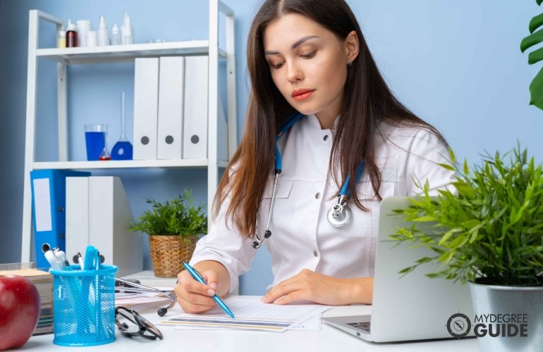 female doctor working in her office