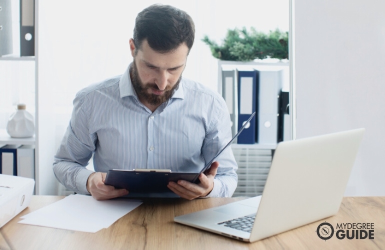 Man preparing requirements for Masters in Health Services Administration