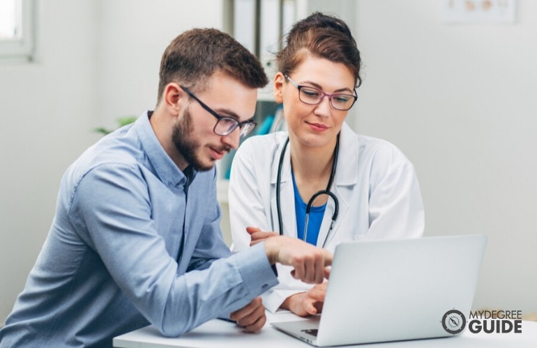 doctor showing medical results of her patient