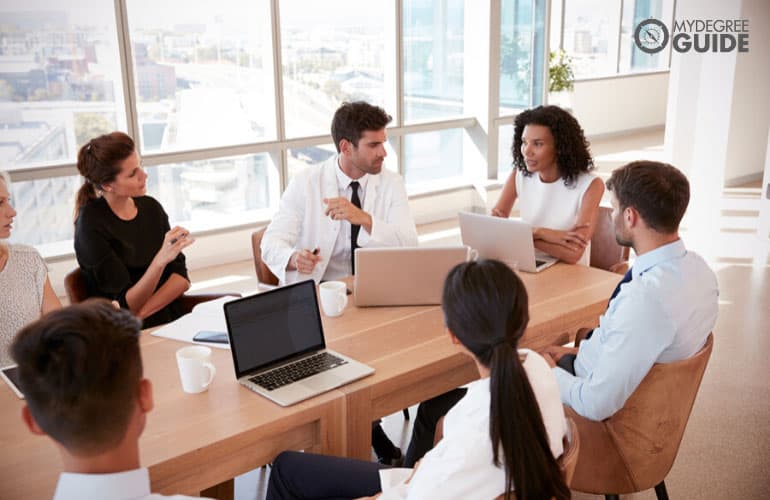 Health Services Manager having a meeting with healthcare professionals