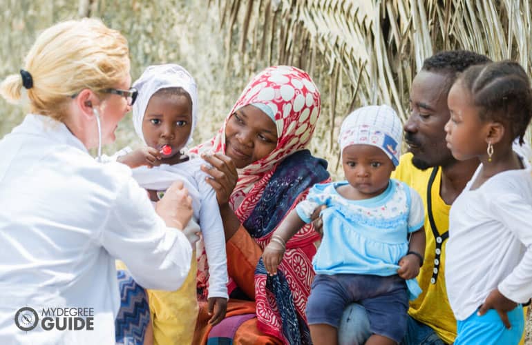 social health worker helping an indigenous family