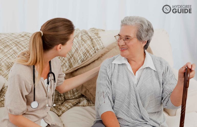 female nurse taking care of an elderly woman