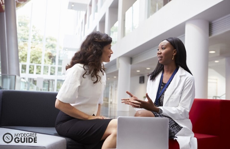 healthcare administrator talking to a staff applicant