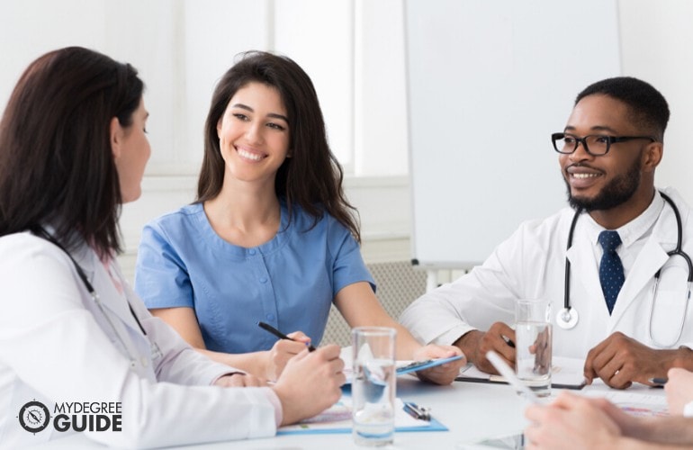 healthcare manager meeting with medical staff in hospital