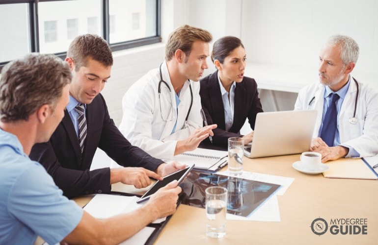 healthcare administrators meeting in an office