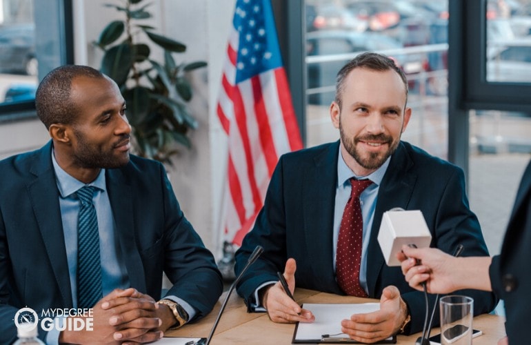 Diplomats being interviewed by reporters