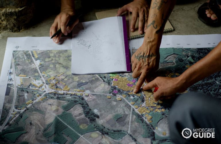 geographer marking maps