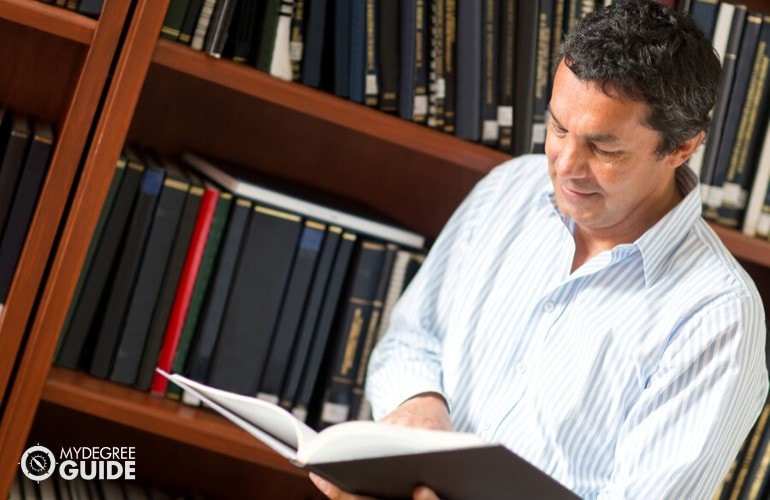 Academic Researcher researching in a library