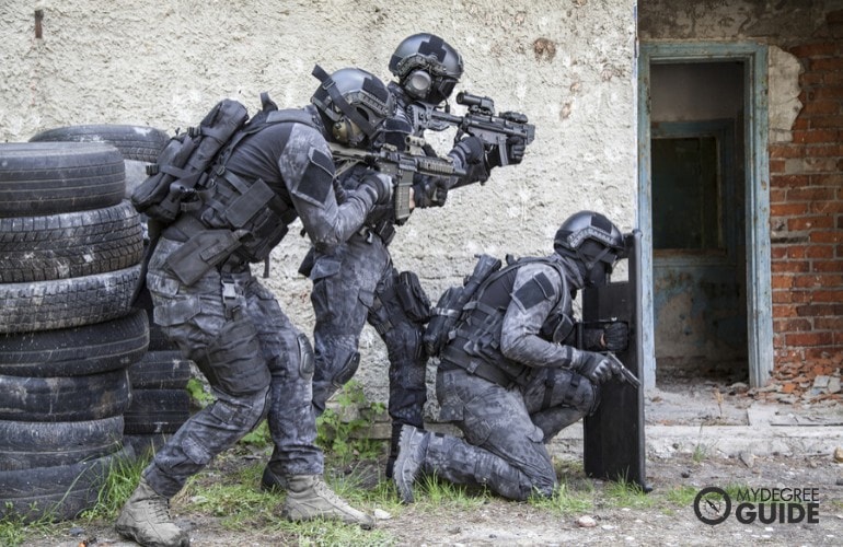 SWAT officers preparing to enter a building