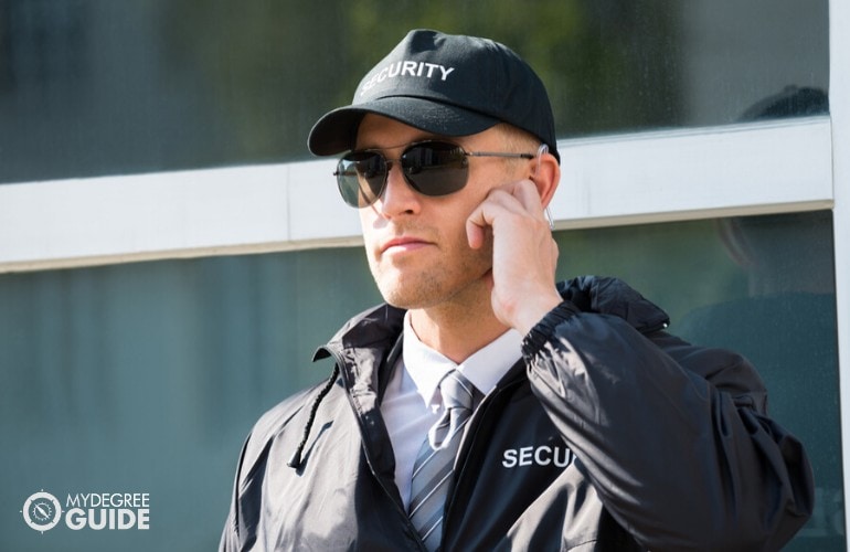 homeland security officer guarding a building