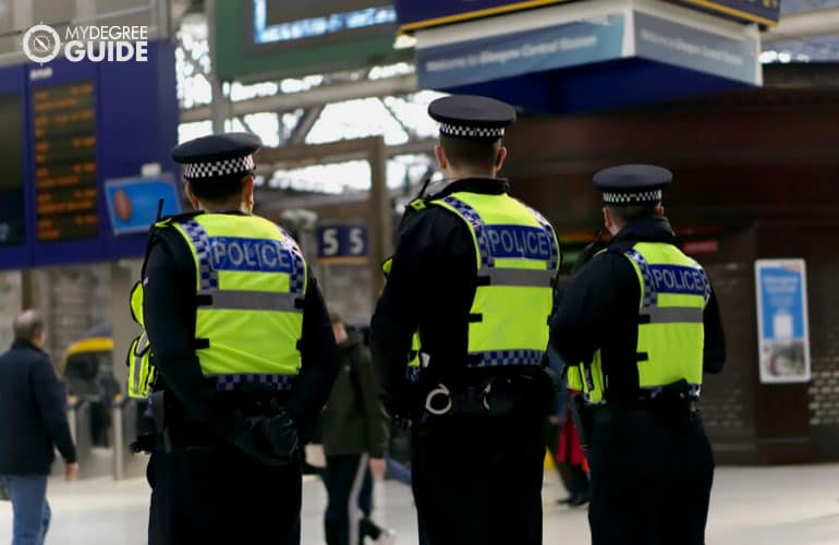 police patrol on standby in a train station