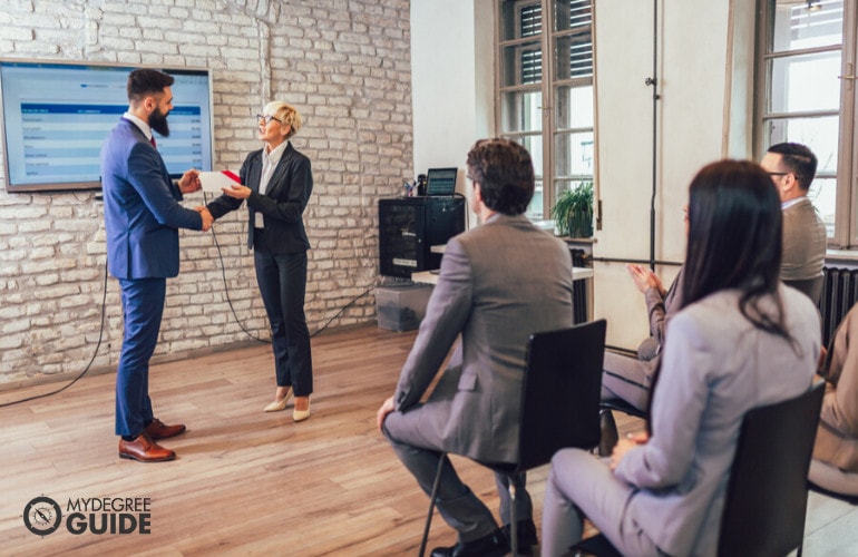 behavioral therapist receiving a professional certificate