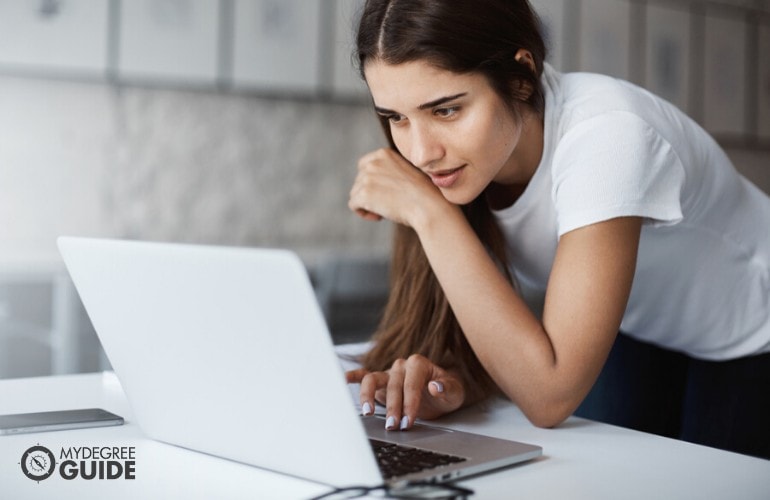 Bachelor's degree student studying on her laptop