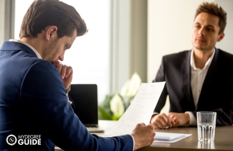 human resource manager checking an applicant's resume