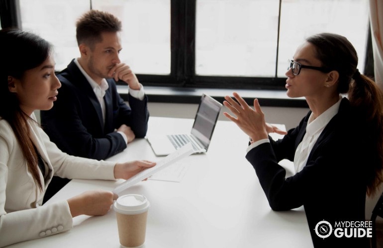 company's human resource persons interviewing a job applicant