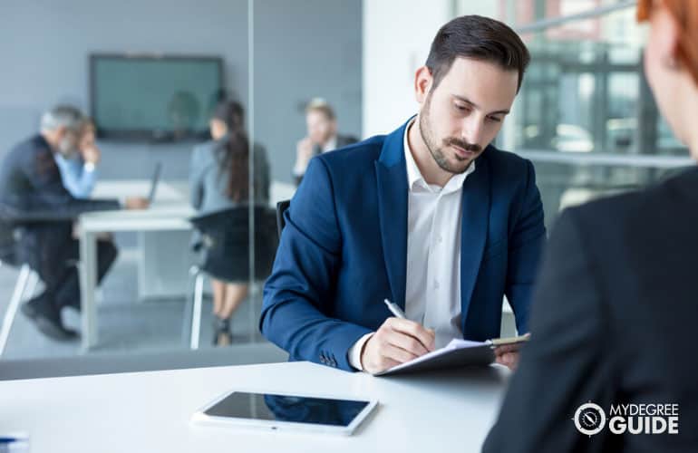 human resources manager interviewing a job applicant in an office