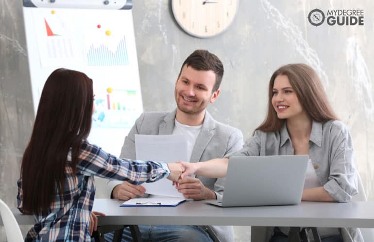 human resource managers interviewing a job applicant